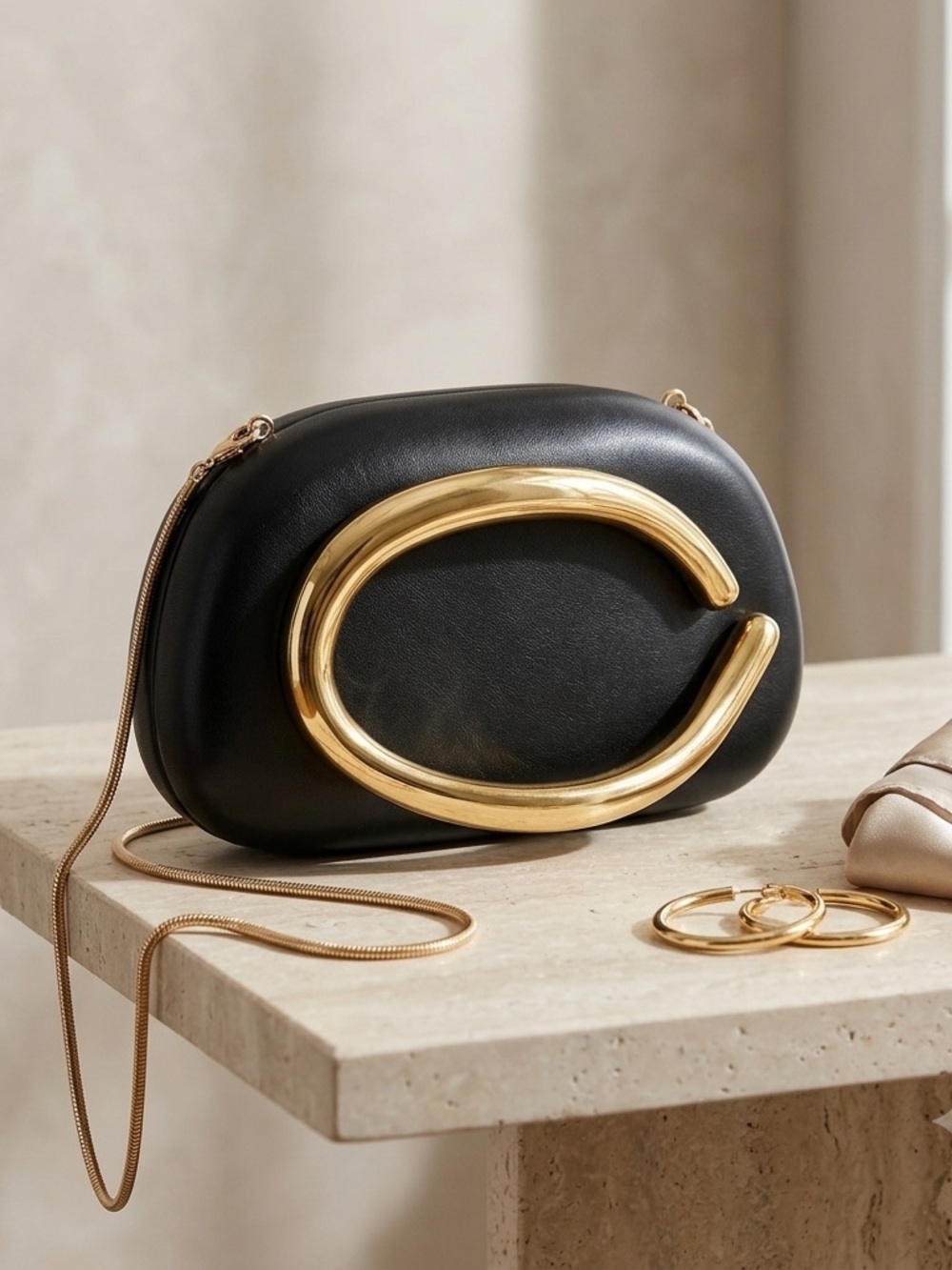 Elegant Black Clutch with Gold Statement Handle